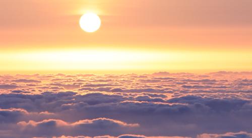 Sunrise over clouds