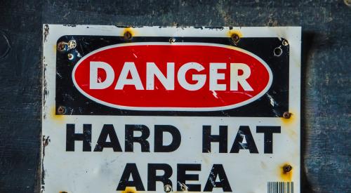 Sign saying "Danger Hard Hat Area"