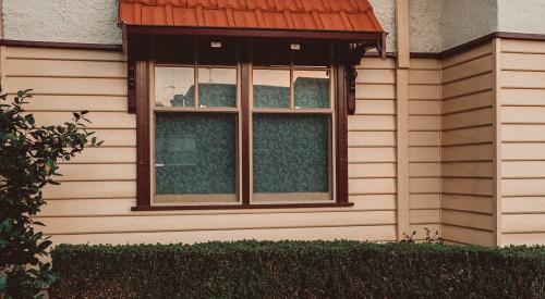 House exterior with flower garden