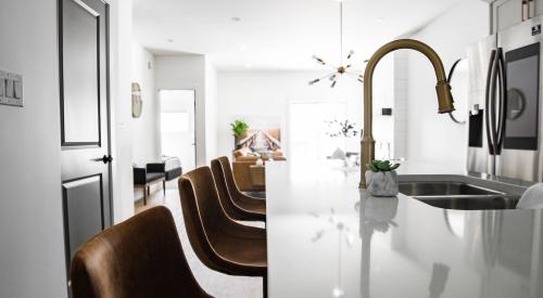 Kitchen island with sink, faucet, and seating