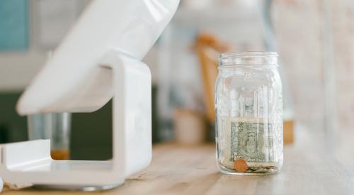 Tip jar on counter by register