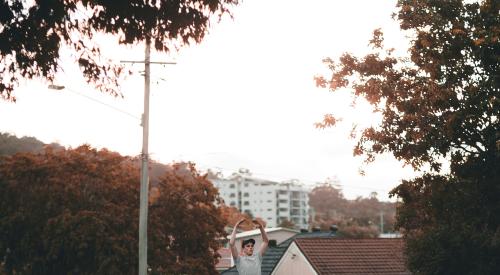 Man dancing on a suburban street