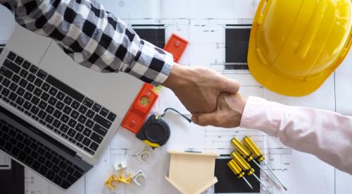 Landlord shaking hands with home builder