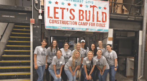 Girls at the Let's Build Construction Camp learning plumbing skills