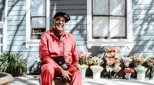 Man in front of flower shop