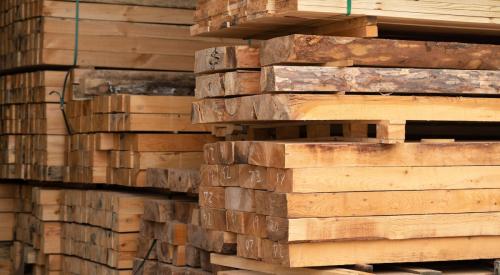 Stacks of lumber pallets in warehouse