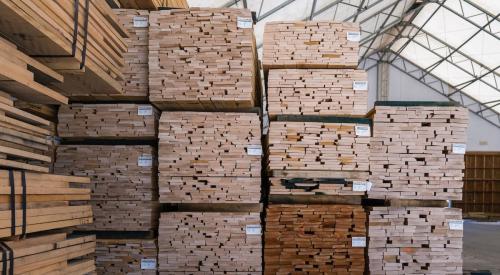 Lumber pallets marked and stacked in warehouse