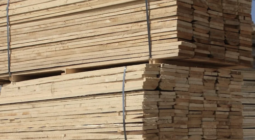 Lumber stacked in lumberyard 