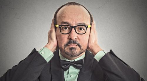 Man with hands covering ears not listening to customers who want to buy a home online