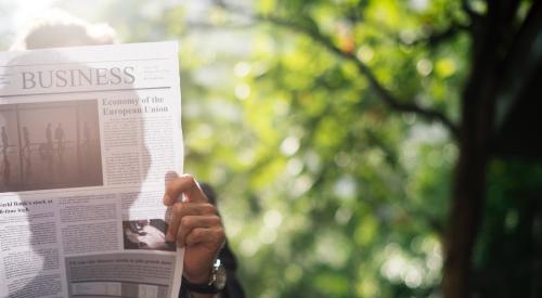 Man reading business newspaper