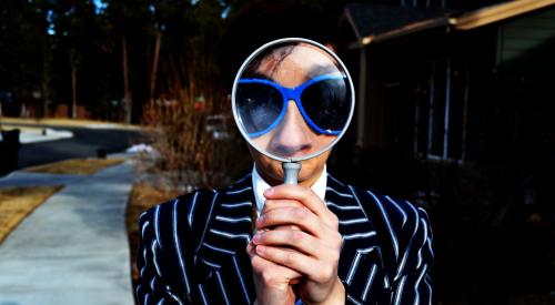 Woman with magnifying glass