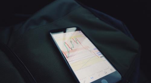 Phone with stock market data on screen