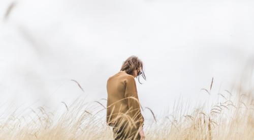 girl looking away in field