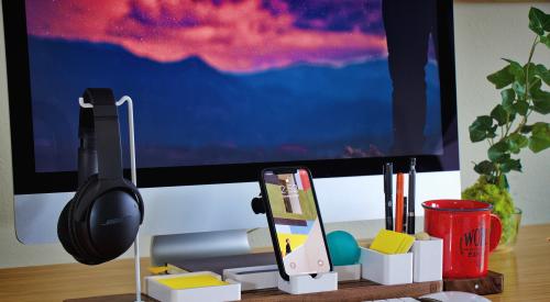 Desk with computer and other office supplies