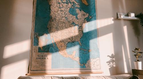 House interior with sofa and map of North America