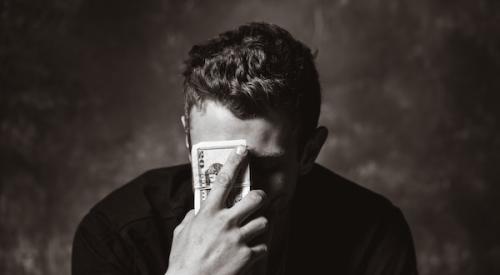 Man upset about financial stress