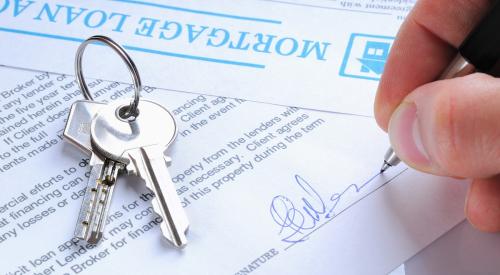 Mortgage loan paperwork with house keys