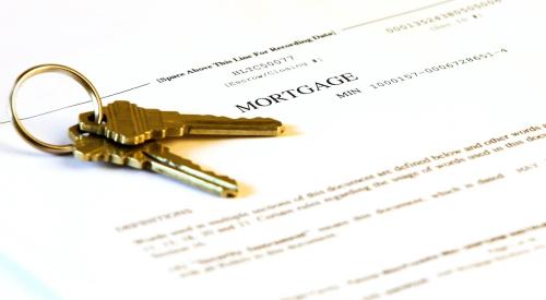 Mortgage application form and set of brass keys