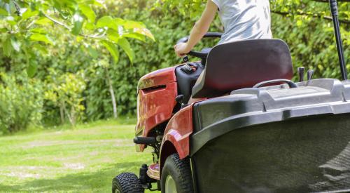 woman on riding mower