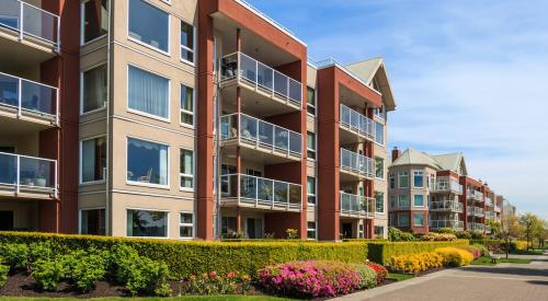 Red and tan multifamily apartment buildings