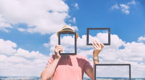 Man with multiple technological devices