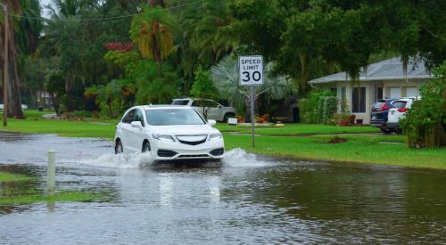 Street flooded in residential neighborhood