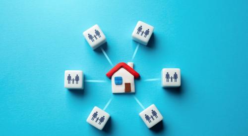 Dice with family graphics surrounding house with red roof