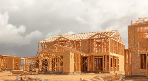 Row of newly framed homes under construction 