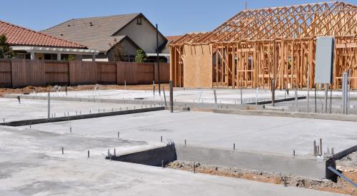 Empty single-family lot with concrete poured