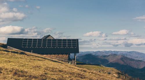 Off-grid mountain home with solar panels