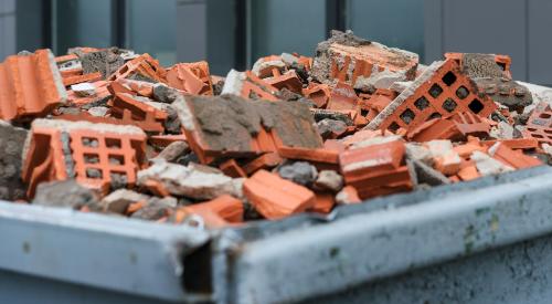 Bricks from demolition project in bin