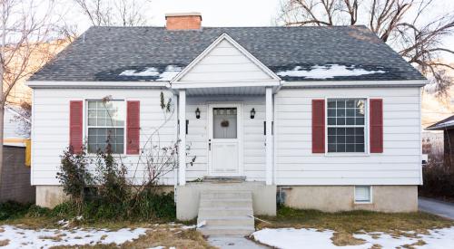 An example of older housing stock: a single-family house with white exterior