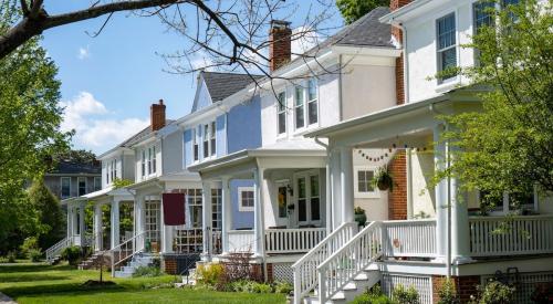 Older houses line the street in a residential neighborhood