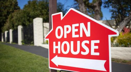 Red open house sign along street