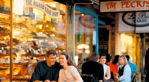 happy couple sitting outside cafe