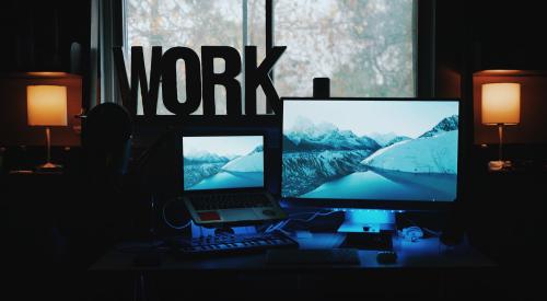 Home office interior with 'WORK' sign