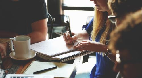 Employees working together at desk