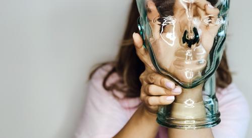 Woman holding glass sculpture