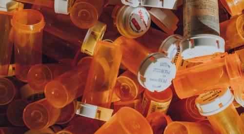 Piles of empty medication bottles