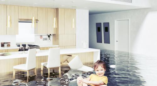 Baby on floaty in a flooded living room