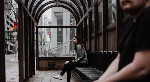 Woman waiting for public transit