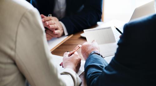 People at a desk in a bank