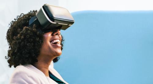 Woman sitting with VR headwear on