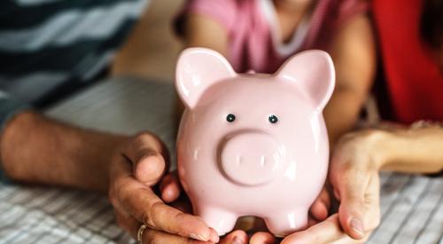 People holding piggy bank in hands