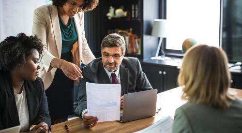 Women and man in office