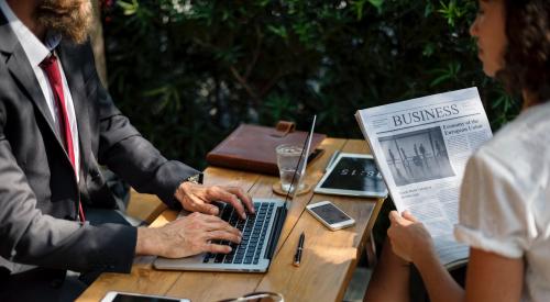 Two people discussing business