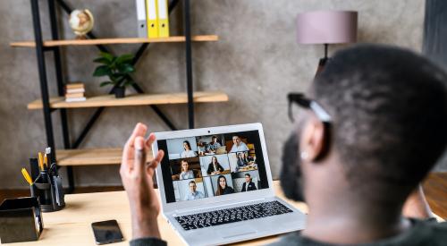 Man in virtual meeting at home office