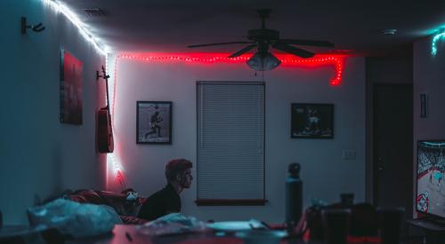 Young man in a home playing video games