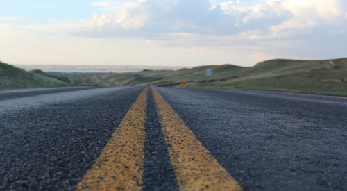 Image of a road--employees are traveling farther to get to work, study finds.