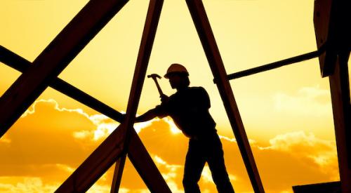 Roofer at sunset